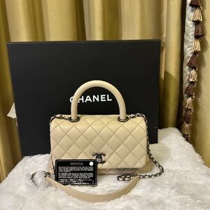 Chanel Beige Mini COCO Caviar with top handle bag.